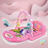 Pink baby play gym with piano, featuring hanging toys and colorful animal designs for infant sensory development.