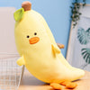 Banana Carrot Plush Fruit Pillow Toy on a table, soft yellow fabric with cute face and green leaf, perfect for home decor and comfort.