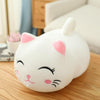 Plush fat cat doll on a table, featuring a cute white and pink design, perfect as a stuffed animal pillow toy for snuggling and decoration.