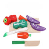 Wooden fruit and vegetable cutting toy set with colorful pieces and a wooden knife on a cutting board for imaginative play.