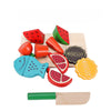 Wooden fruit and vegetable cutting toy set with fish, watermelon, and biscuits on a board, featuring a wooden knife for imaginative play.