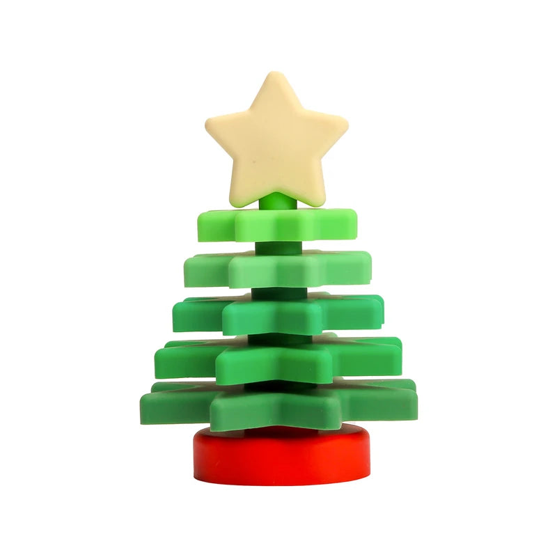 Silicone Christmas tree stacking toy with star topper on white background.