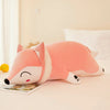 Cute kawaii plush fox stuffed animal toy in pink, perfect for hugging and cuddling on a bed or as a charming room decoration.