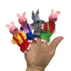 Hand displaying soft animal finger puppets for storytelling and imaginative play.