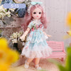 Articulated 1/6 BJD doll in a blue lace dress, posed in a floral setting, perfect for imaginative play and storytelling.