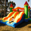 Child playing on a colorful kids inflatable bouncy castle with slides, perfect for outdoor fun and entertainment.