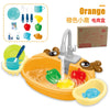 Kids electric kitchen sink playset with working faucet and toy dishes in orange, featuring pretend dishwasher accessories.