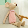 Adorable baby mouse plush toy in pink outfit sitting on a chair, perfect for cuddling and gifting.