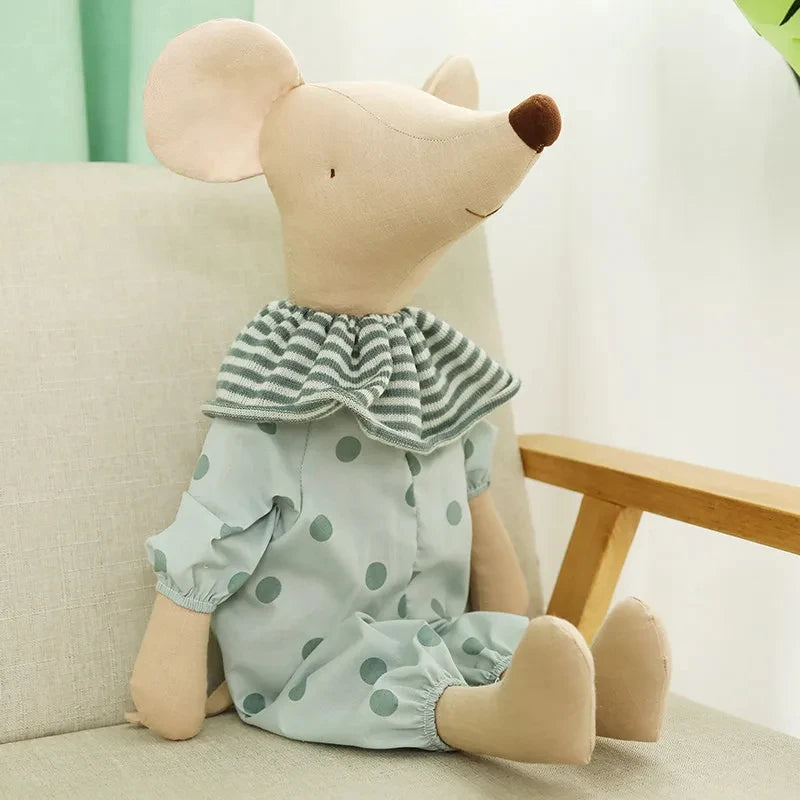 Adorable baby mouse plush toy with polka dot outfit sitting on chair, perfect for cuddling and gifting.