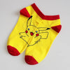 Bright yellow cotton socks featuring a Pikachu design, perfect for Pokemon fans. Soft, plush material for warmth and comfort.