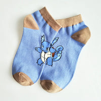 Blue cotton socks featuring a Squirtle design, perfect for Pokemon fans looking for cozy, fun, and stylish accessories.