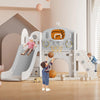 Toddler playing on 8-in-1 playset with slide, basketball hoop, and climbing features in a bright playroom setting.