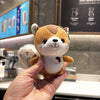 Kawaii squirrel plush toy held in a hand, featuring soft plush fabric and a cute design, ideal for decoration or as a keychain accessory.