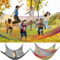 Children playing on a colorful climbing cargo safety net in a sunny outdoor park, showcasing fun and durability for active play.