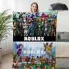 Roblox-themed winter sofa blanket with colorful character design, perfect for gaming nights, shown held up by a smiling person.