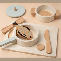 Wooden kids kitchen playset with pot, pan, spatulas, cutting board, and toy fish for pretend cooking fun.