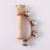 Wooden bear-shaped rattle with bells for kids' musical play and sensory development.