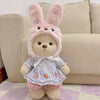 Little bear plush doll dressed in pastel bunny outfit with changeable clothes, sitting on a patterned rug, perfect for cuddling and play.