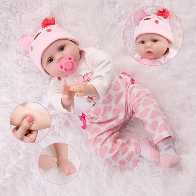 Realistic soft vinyl reborn baby doll in pink outfit with pacifier, showcasing lifelike features and gentle touch for kids and collectors.