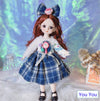 12-inch fashion doll wearing a blue plaid dress with red hair, featuring stylish outfit and lifelike design for imaginative play.