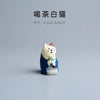 Japanese cat statue in blue holding a teacup, perfect for fairy garden and mini decor, 4.5x2.5x3cm size.