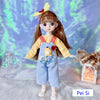 Fashion doll in striped outfit with bear applique, yellow bow accessory, and shoes stands against a colorful background.