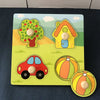 Montessori wooden puzzle for toddlers featuring colorful shapes of a tree, house, car, and ball to enhance learning and coordination.