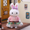 Adorable miniature rabbit critter in dollhouse setting wearing a pink dress, part of DIY playset for imaginative kids' play.