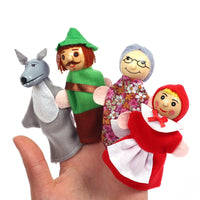 Hand holding soft animal and character finger puppets for imaginative storytelling.