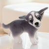 Adorable gray and white plush puppy doll with realistic design, perfect for dog lovers and kids, displayed on a light surface.