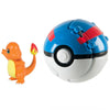 Charmander toy figure next to a blue and red Pokeball collectible, perfect for Pokemon fans and collectors.