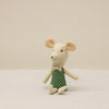 Cute plush mouse doll with a green polka dot outfit sitting on a neutral background.