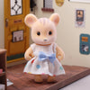 Cute miniature rabbit figure in polka dot dress standing by dollhouse door, perfect for imaginative playset and decoration.