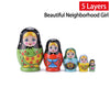 Five-layer wooden Matryoshka dolls with vibrant designs, labeled 'Beautiful Neighborhood Girl'.