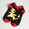 Pokemon-themed black and red cotton socks featuring Charmander design, perfect for cozy, unisex wear, made from plush material.