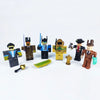 Roblox-themed collectible dolls arranged with accessories, ideal for fans and collectors of the virtual world game.