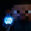 Minecraft Creeper LED Night Light held in hand, glowing blue, perfect for kids' bedside decor, USB and battery powered.