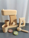 Wooden pretend play kitchen set with a coffee machine, cup, and play coffee pods. Montessori toy for creative role-playing.