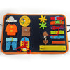 Montessori Busy Board with zippers, buttons, shapes, and colors for toddler motor skills and sensory play development.