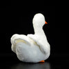 Realistic plush duck toy with soft white fabric and orange beak against a black background.