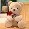 Plush rose teddy bear holding a red rose, perfect for cuddling and gifting on special occasions.