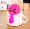 Pink vomiting toy on a cup for stress relief and pranks