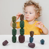 Child playing with colorful Montessori wooden cactus stacker toy blocks, enhancing creativity and fine motor skills.