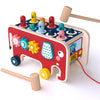 Wooden Montessori animal bus pounding bench toy with vibrant colors and wooden hammers for toddlers' motor skills and sensory play.