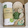 Baby Teething Toy Gift Set with gauze blanket, beech wood teething toys, wooden milestone, and sensory accessories in box.