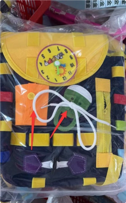 Toddler Busy Board Backpack with colorful buttons, zippers, and laces for skill development and interactive learning.