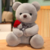 Plush rose teddy bear holding a red rose, made from soft short plush, perfect for cuddling or gifting on special occasions.