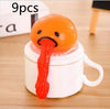 Funny Vomiting Egg Yolk Toy with orange head and red slime, set of 9, perfect for stress relief and pranks.