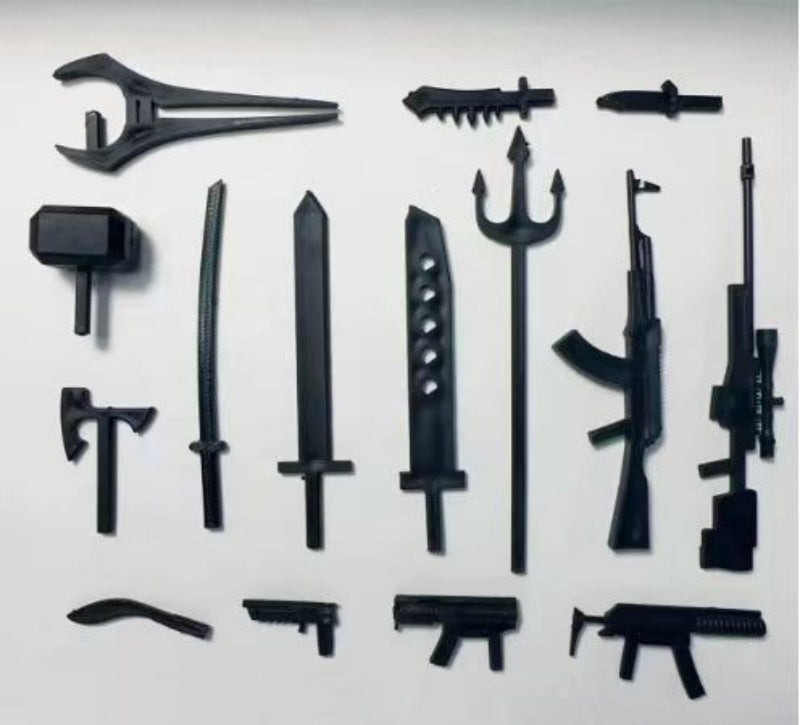 Assorted black 3D-printed action figure weapons, including swords, guns, and axes, displayed on a white background.