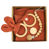 Baby Teething Toy Gift Set with gauze blanket and wooden teething toys for soothing and sensory development.